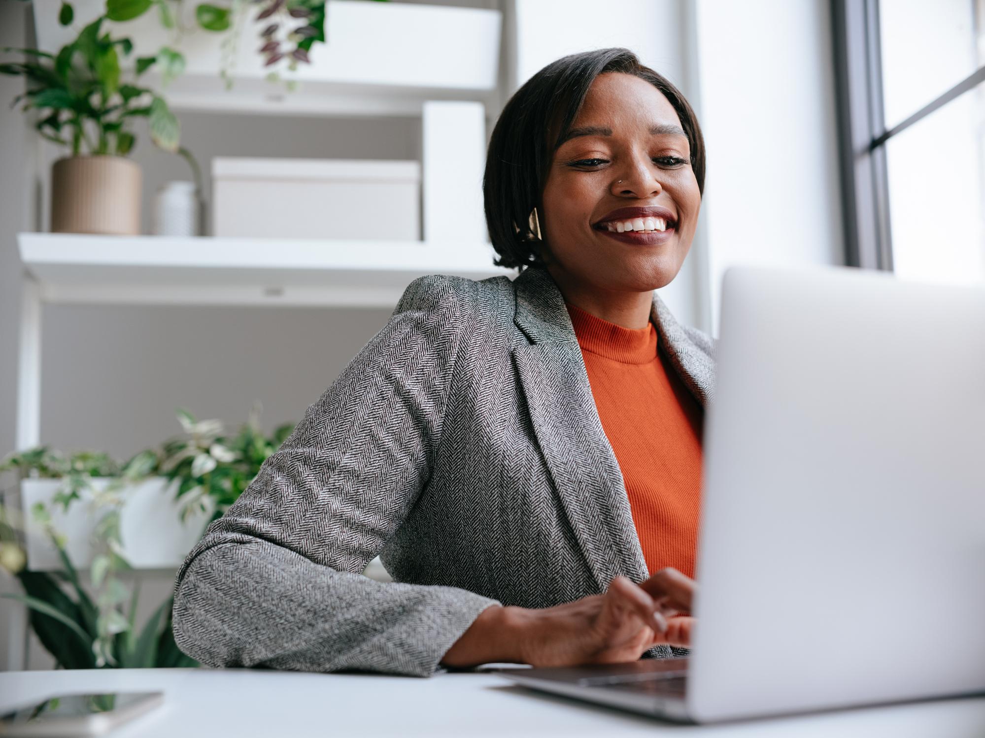 Professional woman working at a laptop